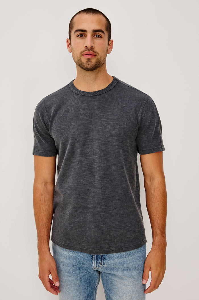 Brooks Short Sleeve T-Shirt With Crew Neckline, Short Sleeves, and Classic Fit in Washed Black Colorway - Upper Body Front View Featured on Model