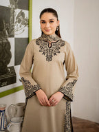 Elegant sand-colored embroidered shirt for women with intricate black threadwork.