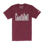 A maroon and gold unisex crew t-shirt with the word 'CLEVELAND' printed in white, featuring the city's skyline.