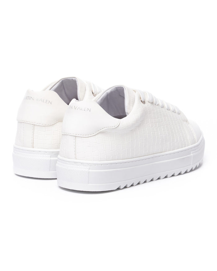 Martin Valen Dino white low-top sneakers, three-quarter front view showing thick platform sole and smooth toe