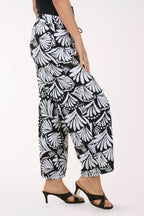 Black and white patterned pants worn by a person on a white background