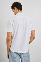 Flint Collared Button Shirt with Short Sleeves and a Chest Pocket in White Colorway. Back View Shown on Model.