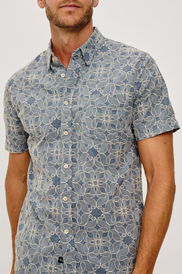 Hale Button-Up Short Sleeve Shirt in Lightweight Cotton With Contrast Jute Floral Embroidery and a Classic Fit in Daisy Steel Colorway - Upper Body Front View Featured on Model