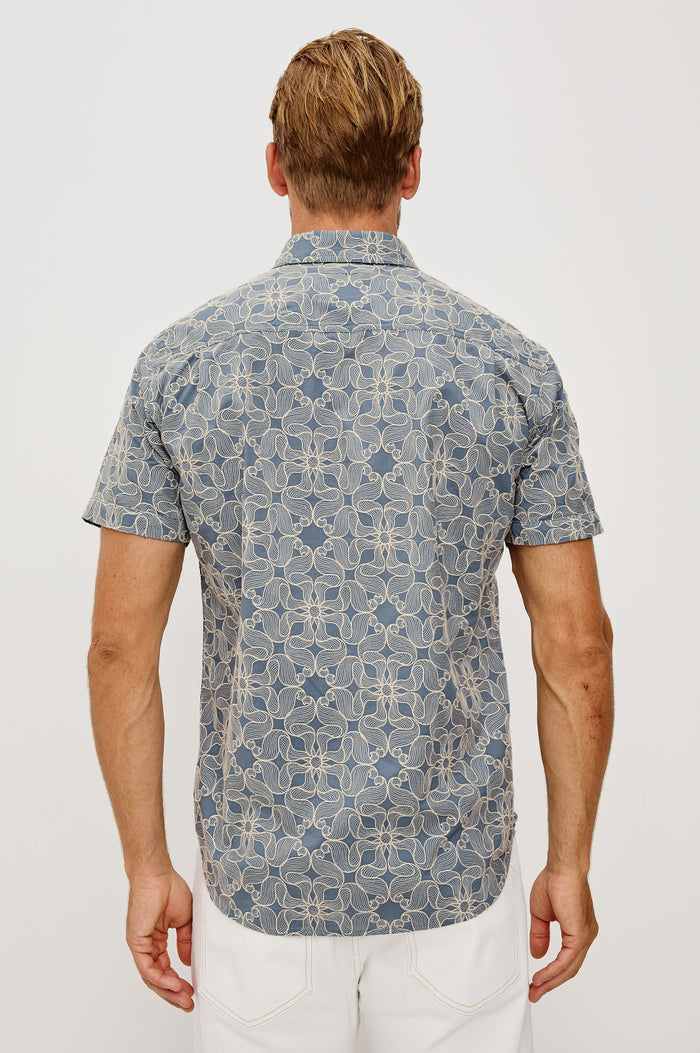 Hale Button-Up Short Sleeve Shirt in Lightweight Cotton With Contrast Jute Floral Embroidery and a Classic Fit in Daisy Steel Colorway - Upper Body Back View Featured on Model