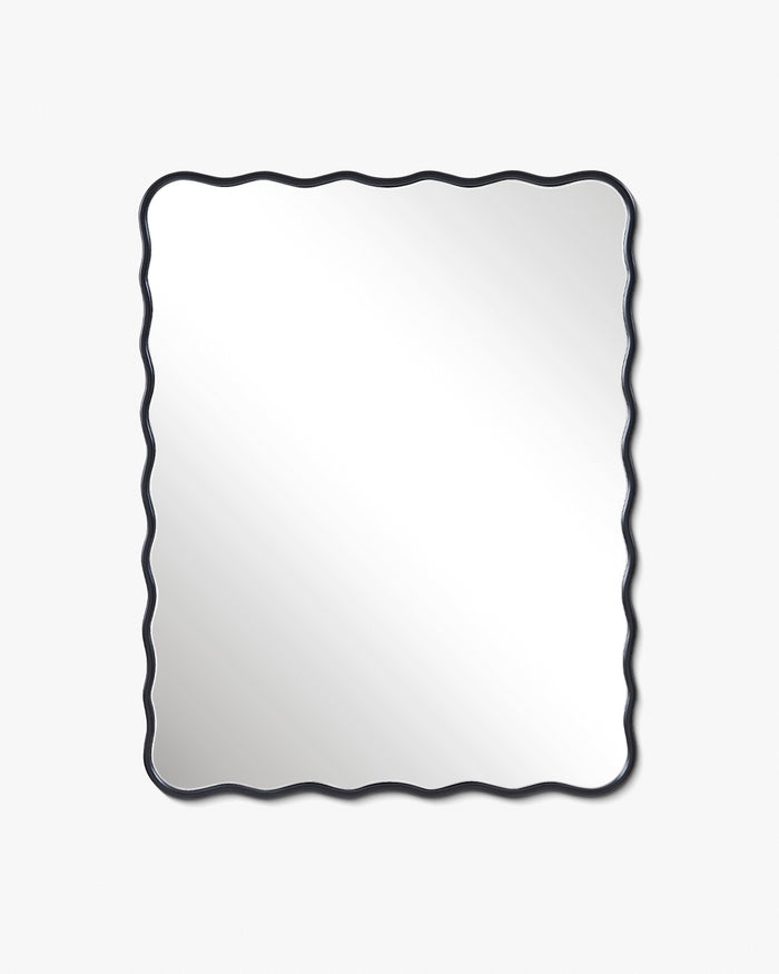 Rectangular wall mirror with a black frame and softly wavy edges, shown in a vertical orientation.