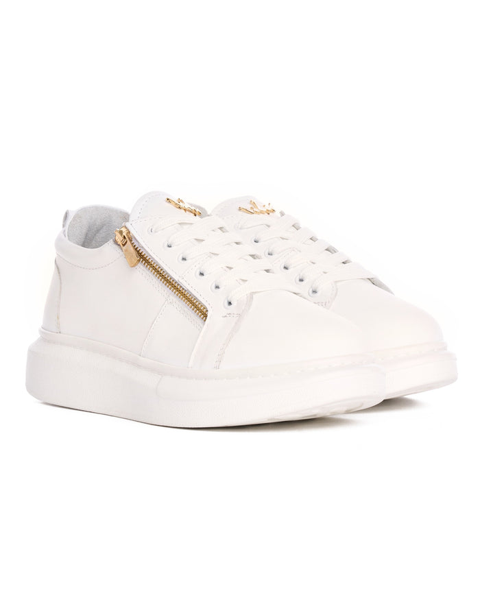 Martin Valen Hype Sole pair of white leather sneakers, top-close view showing laces and gold ornament