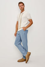 Leo Knit Sweater Polo in Yarn-Dyed Cotton Blend With Collar, Front Buttons, and Short Sleeves in White Cashew Colorway - Full Body Front View Featured on Model
