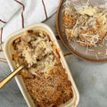 Creamy pasta bake with sausage and crispy breadcrumb topping, served in eco container and on plate