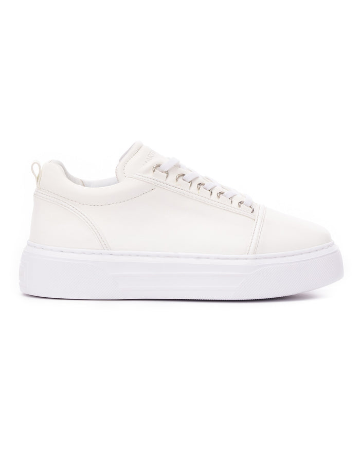 Martin Valen men's Trine white sneaker, side profile on white background showing thick platform sole and metal eyelets