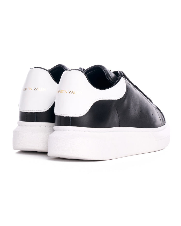 Martin Valen Crowned Hype Sole men's sneakers, three-quarter front view showing black toe, laces and chunky white sole