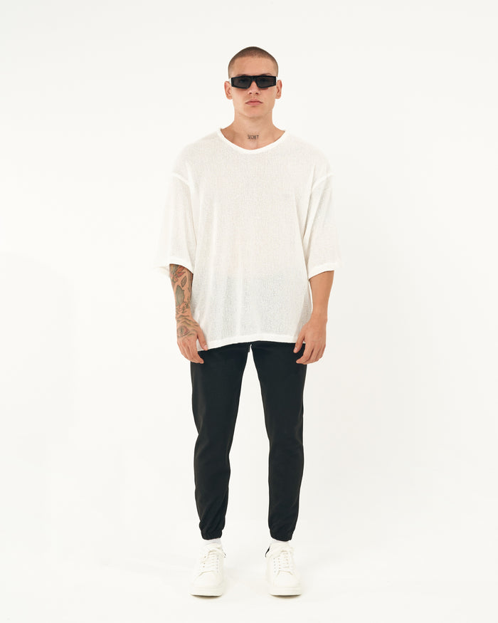 Martin Valen black men's jogger with elastic cuffs, full-length front view showing whole silhouette