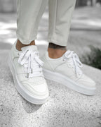 Martin Valen men's white high sneakers, top-front view worn on concrete showing thick platform sole and laced upper