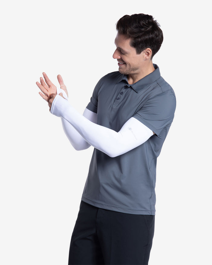 Man wearing short sleeve polo shirt in smoke with sun protective sleeves in white. (Style 11004) - BloqUV