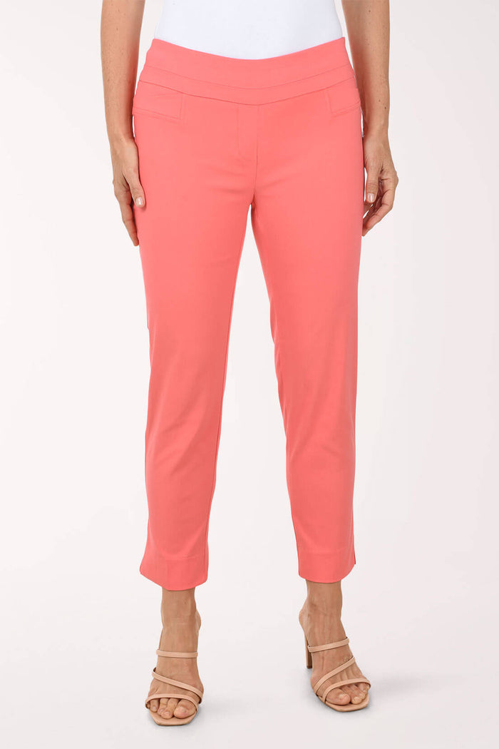 Coral pants worn by a person on a white background