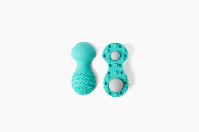 Neuro Roller | RAD wellness device in teal, featuring textured silicone surface and dual roller design for targeted body care and recovery.