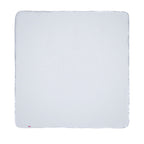 The Nuby US No-Mess Mealtime Mat is a square, white cloth with rounded corners and a red tag in one corner, shown flat on a white background—versatile and easy to clean for hassle-free meals.
