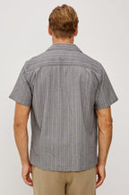 Ohana Button-Up Shirt in Textured Shirting WIth Short Sleeves, Collar, and Relaxed Fit in Charcoal Chambray Colorway - Upper Body Back View Featured on Model