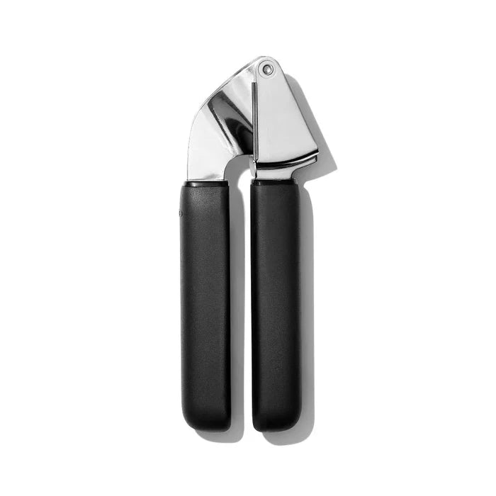 Garlic press with black handles on a white background