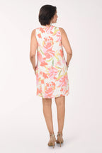 Woman wearing a floral dress on a white background