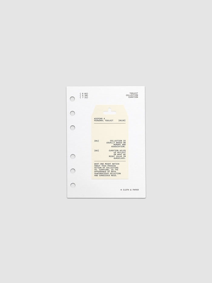 Personal Toolkit Planner Dashboard in A6 6-Ring Punch, a cardstock dashboard with an affixed warm gray printed tag in black type on a light gray background