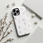 Blush pink tough phone case with bridal-themed doodles, flowers, and stationery accents.