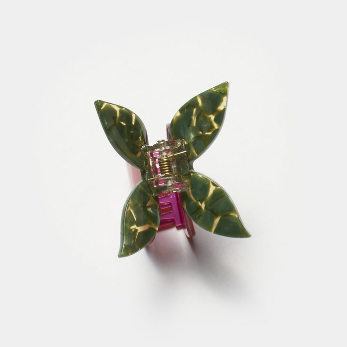 Butterfly hair claw with green marbled wings, purple base, and silver prongs