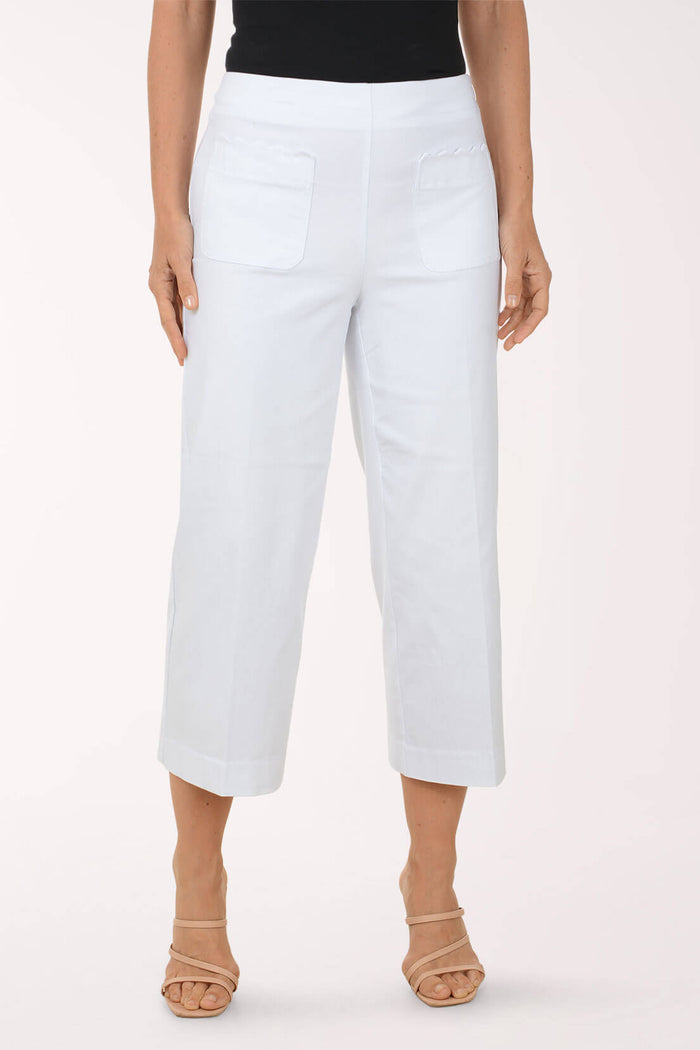 White pants worn by a person on a white background