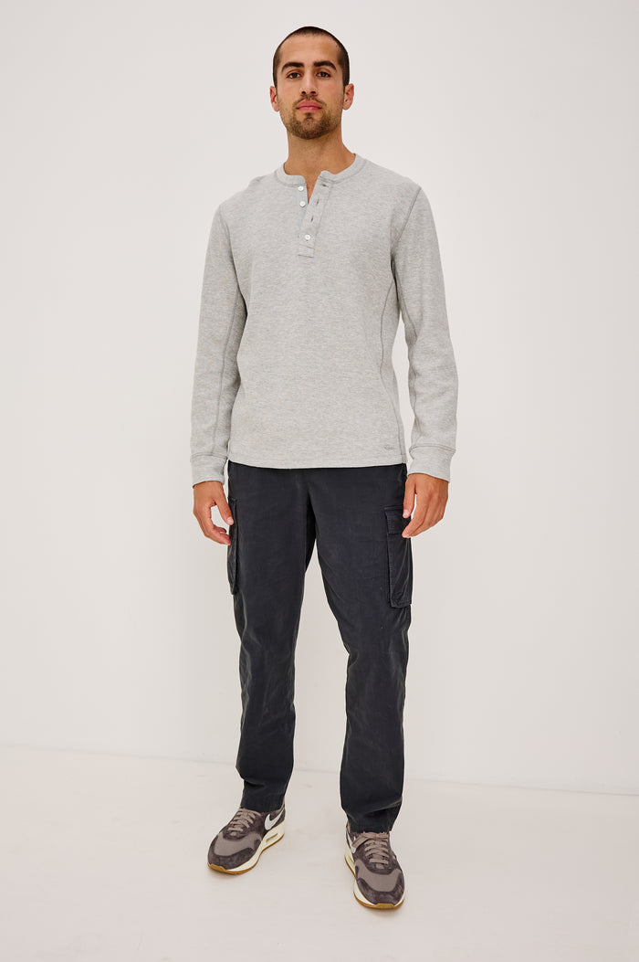 Soto Henley in Rib Cotton With Half Button Placket, Long Sleeves, and Crew Neckline in Grey Heather Colorway - Full Body Front View Featured on Model