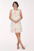 Woman wearing a patterned dress on a white background