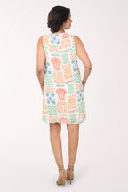 Woman wearing a patterned dress on a white background