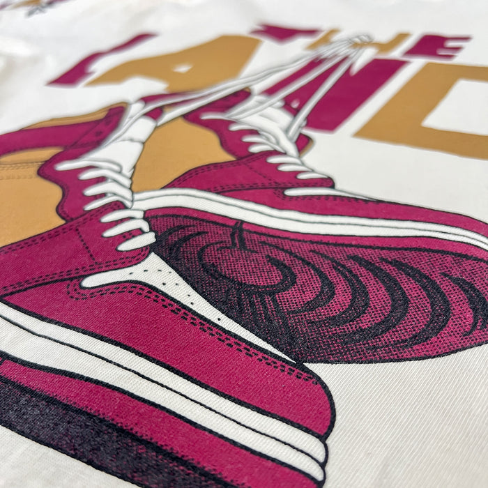 Close-up of a graphic design featuring pink sneakers on a white background