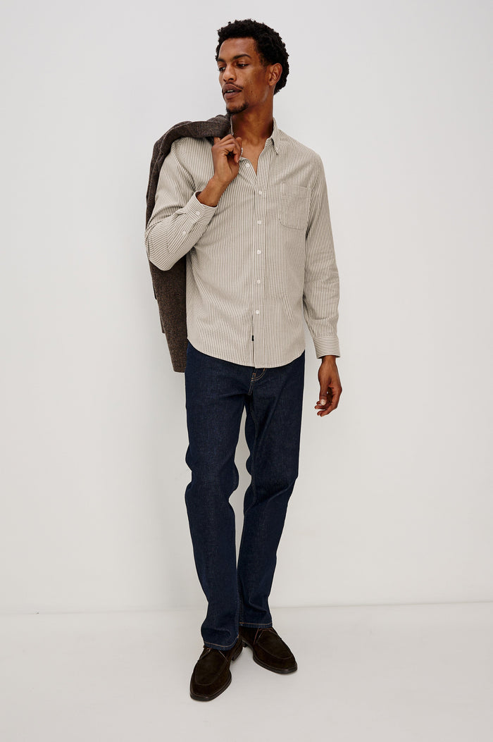 Vance button front collared shirt with long sleeves, collard stand buttons and a single chest pocket in Cedar Oat Stripe colorway. Full body front view shown on model.